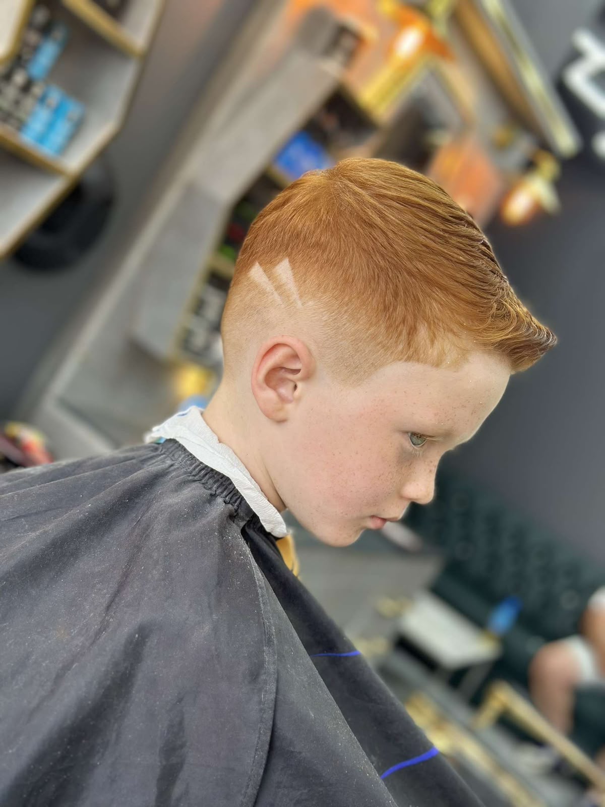 Low fade · accent lines at ZK Barber's